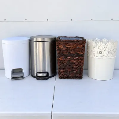 B assortment of four decorative garbage cans