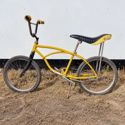 C 1970s style yellow schwinn badged banana seat bicycle