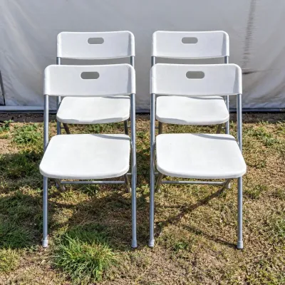 F set of 4 white folding chairs