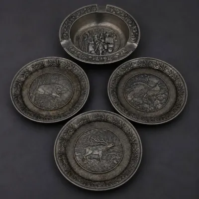 Ld set of four pewter plates and ashtray