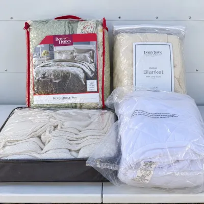 B assortment of premium blankets and quilt sets