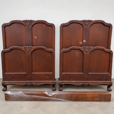 F pair of matching ornate twin bed frames