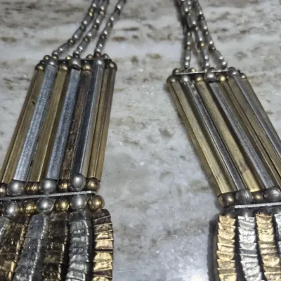 Sale Photo Thumbnail #284: Vintage Egyptian Revival Necklace ~ 7 strands
> tribal bib neck;lace 20" long with lobster clasp
> added extention chain 3"
> all metal in excellent condition. no damage/ pulls / separations