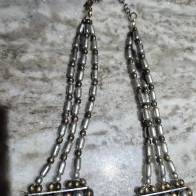 Sale Photo Thumbnail #285: Vintage Egyptian Revival Necklace ~ 7 strands
> tribal bib neck;lace 20" long with lobster clasp
> added extention chain 3"
> all metal in excellent condition. no damage/ pulls / separations