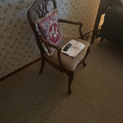 Sale Photo Thumbnail #26: Vintage Chippendale style upholstered armchair with carved wood splat and cabriole legs, paired with an embroidered throw pillow.