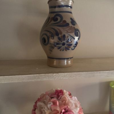 Sale Photo Thumbnail #69: German Westerwald salt-glazed stoneware pitcher with hand-painted blue and brown floral motifs, featuring a hinged metal lid.