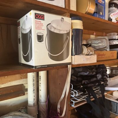 Sale Photo Thumbnail #95: Boxed Oggi insulated ice bucket with acrylic lid sits on a wooden shelf alongside thermos bottles and kitchen storage items.