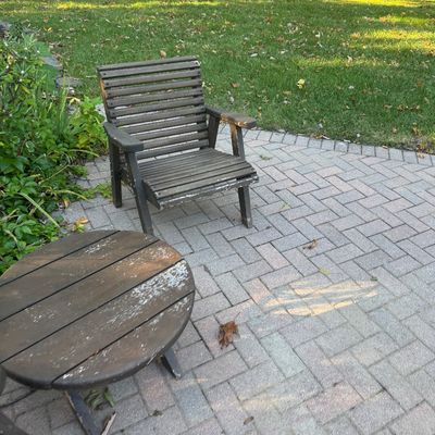 Sale Photo Thumbnail #136: Weathered wooden patio set including a slatted armchair and round side table, showing significant finish wear.