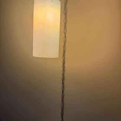 Sale Photo Thumbnail #58: Vintage mid-century modern swag pendant lamp featuring a cylindrical frosted glass shade suspended from a metal link chain.