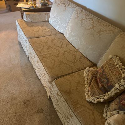 Sale Photo Thumbnail #178: Vintage three-cushion sofa upholstered in a gold damask brocade pattern, shown with matching decorative throw pillows.