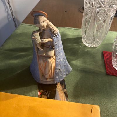 Sale Photo Thumbnail #189: Vintage ceramic figurine of the Madonna and Child in a patterned blue cloak, shown alongside a cut glass vase.
