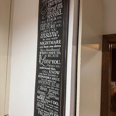 Sale Photo Thumbnail #78: Tall, distressed black wood wall plaque featuring printed white text with a quote titled 'My Promise to My Children'.