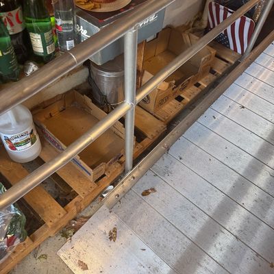 Sale Photo Thumbnail #100: Modular aluminum handicap accessibility ramp with safety handrails set up outside a storage area.