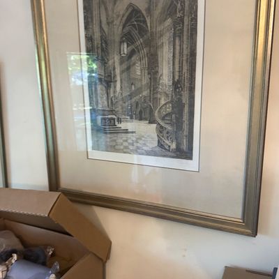 Sale Photo Thumbnail #198: Framed architectural black-and-white print depicting a cathedral interior, presented with an off-white mat in a metallic gold-tone frame.