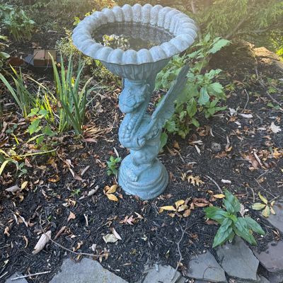 Sale Photo Thumbnail #133: Cast concrete garden birdbath featuring a winged dragon pedestal base supporting a scalloped bowl.