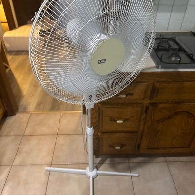 Sale Photo Thumbnail #237: Vintage white SMC oscillating pedestal fan with an adjustable stand and cross base.