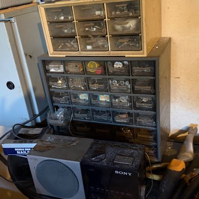 Sale Photo Thumbnail #167: Metal and plastic multi-drawer small parts organizers filled with various hardware and fasteners.