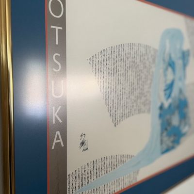 Framed Hisashi Otsuka art print featuring Japanese-style imagery with a blue mat and gold metal frame.