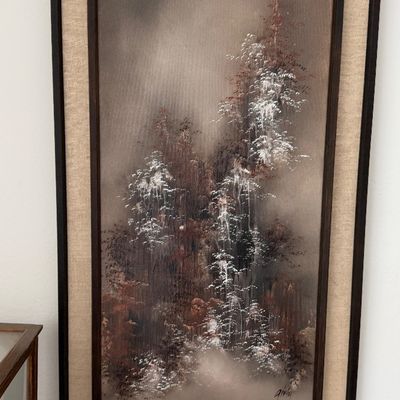 Framed mid-century vertical oil painting depicting a misty, snow-covered landscape or waterfall scene.
