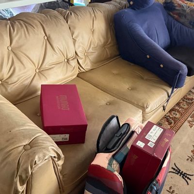 Sale Photo Thumbnail #179: Vintage tufted tan leather sofa featuring button details and thick cushions.