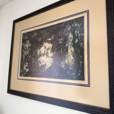 Sale Photo Thumbnail #109: Framed artwork depicting a dark, textured forest landscape scene.