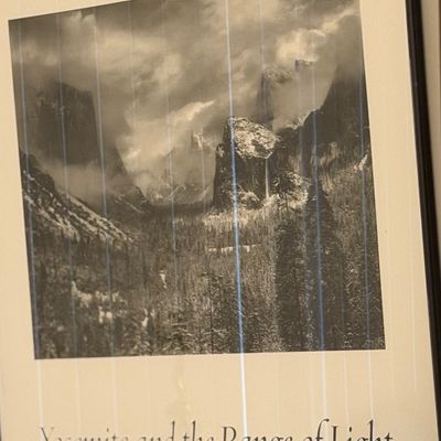 Framed Ansel Adams poster titled "Yosemite and the Range of Light."
