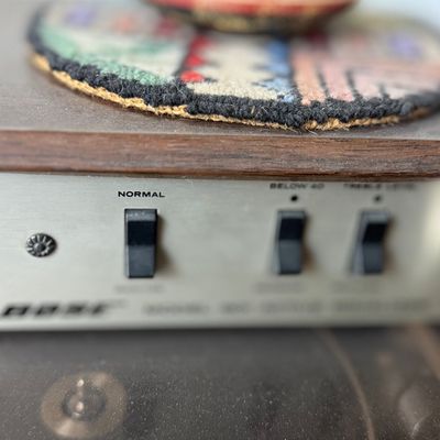Vintage Bose active equalizer unit in a wood cabinet enclosure.