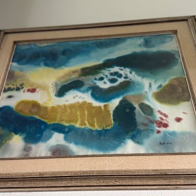 Framed mid-century abstract watercolor painting featuring blue, green, and yellow fluid forms, signed by the artist in the lower right.
