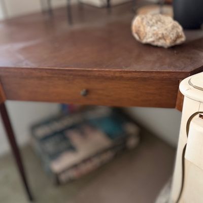 Sale Photo Thumbnail #108: Vintage mid-century corner desk in dark wood finish with a single central drawer.