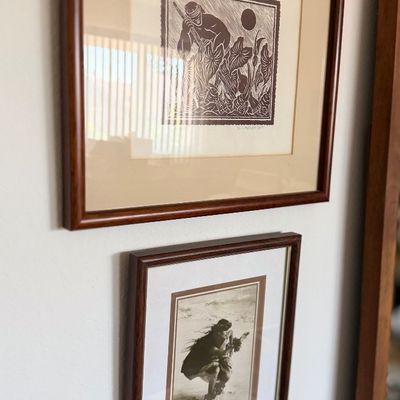 Sale Photo Thumbnail #131: Framed woodcut block print depicting a figure in a taro patch, displayed in a wooden frame with double matting.