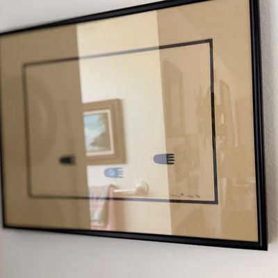 Sale Photo Thumbnail #151: Framed minimal art print behind glass in a black frame, signed and dated in the lower right.