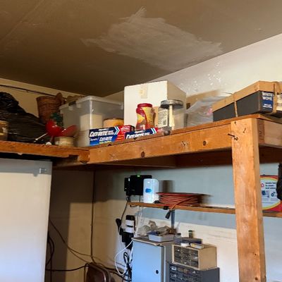 Sale Photo Thumbnail #165: Garage storage shelving filled with household items, vintage thermoses, and supplies.