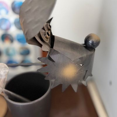 Sale Photo Thumbnail #113: Whimsical scrap metal dog sculpture made from repurposed metal hardware.