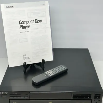 Sale Photo Thumbnail #153: Sony CDP-C235 5-disc carousel CD player in black, complete with original remote control and operating instructions manual.