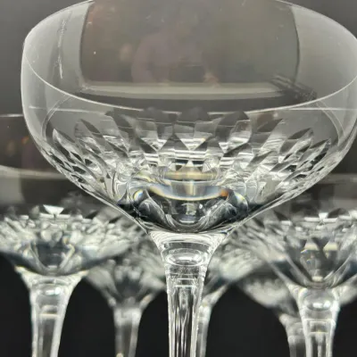 Sale Photo Thumbnail #49: Set of crystal champagne coupe glasses featuring an intricate cut-diamond pattern on the lower bowl and slender multi-faceted stems.