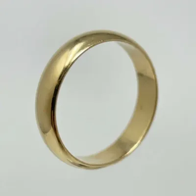 Sale Photo Thumbnail #200: Classic polished yellow gold wedding band with a smooth, domed design.
