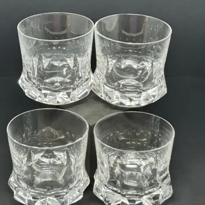 Sale Photo Thumbnail #90: Set of four crystal double old fashioned glasses featuring geometric, wedge-cut bases and smooth rims.