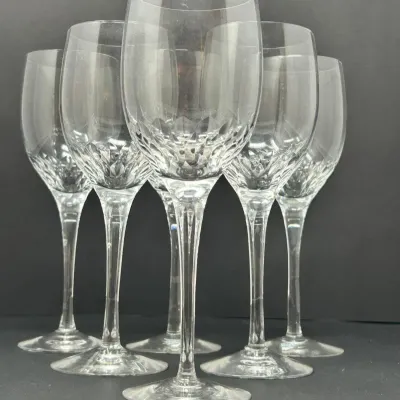 Sale Photo Thumbnail #44: Set of six Waterford crystal wine goblets featuring cut glass detailing along the lower bowl and slender stems.