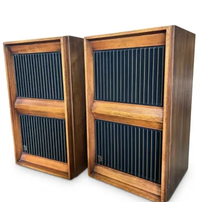Sale Photo Thumbnail #110: Pair of vintage mid-century modern wooden floor speakers featuring slatted front grilles and rich walnut frames.