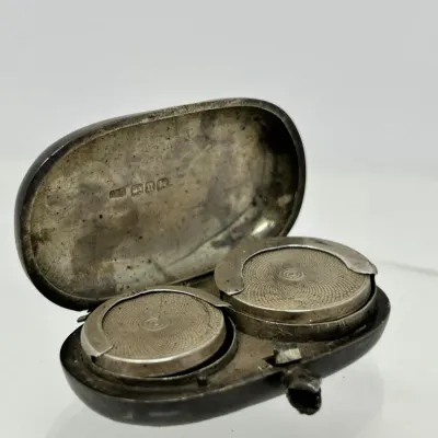 Sale Photo Thumbnail #120: Antique sterling silver sovereign coin case with stamped hallmarks inside the lid and guilloché-engraved spring-loaded coin holders.