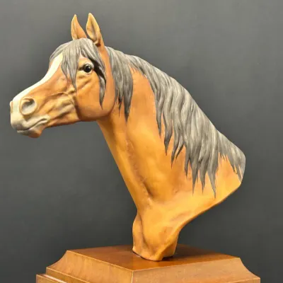 Sale Photo Thumbnail #83: Hand-painted porcelain bust of a horse head mounted on a tiered wooden display base.