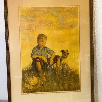 Sale Photo Thumbnail #80: Framed vintage art print titled "Faith" depicting a young boy sitting in a field with his dog, presented in a dark wood frame with a wide mat.