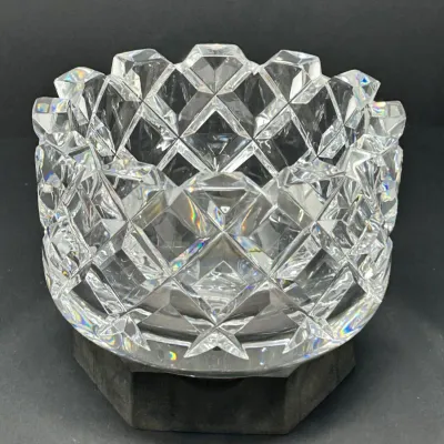 Sale Photo Thumbnail #35: Heavy cut crystal bowl or rose bowl featuring a prominent diamond-and-wedge pattern with a scalloped rim, displayed on a dark base.