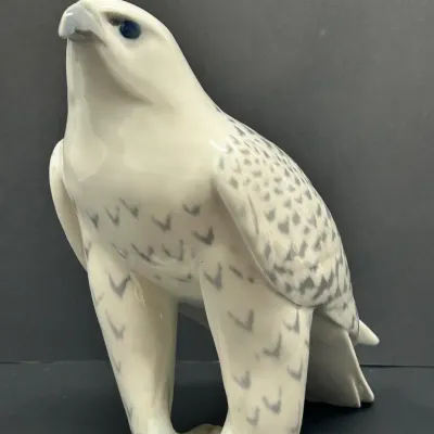 Sale Photo Thumbnail #48: Vintage Royal Copenhagen porcelain falcon figurine, featuring intricate hand-painted feather details and a glossy finish.