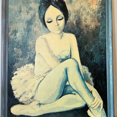 Sale Photo Thumbnail #65: Vintage big-eye portrait painting of a seated ballerina in a tutu, signed Liliana, housed in a coordinating blue-gray wooden frame.