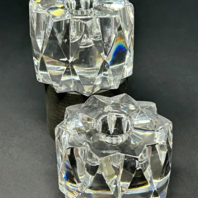Sale Photo Thumbnail #53: Pair of modern heavy cut crystal candlestick holders featuring a starburst geometric pattern.