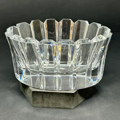 Sale Photo Thumbnail #69: Heavy cut crystal bowl featuring vertical panels and a jagged, scalloped rim.
