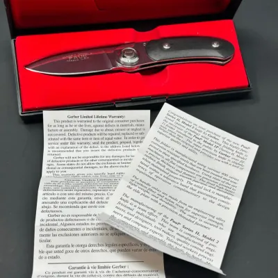 Sale Photo Thumbnail #179: Gerber Paul Series II, Model 2 folding pocket knife presented in its original felt-lined case with paper documentation.