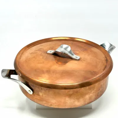 Sale Photo Thumbnail #99: Vintage copper rondeau pan with matching lid and stainless steel side handles.