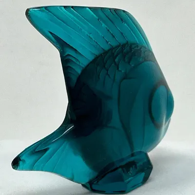 Sale Photo Thumbnail #116: Lalique-style teal crystal fish figurine with detailed scale textures and fins.